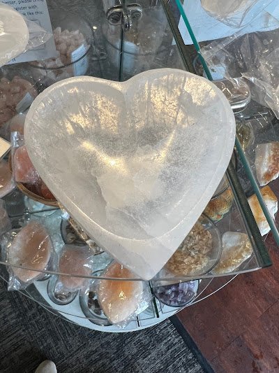 Retail display with tumbled stones, raw crystals, and polished specimens