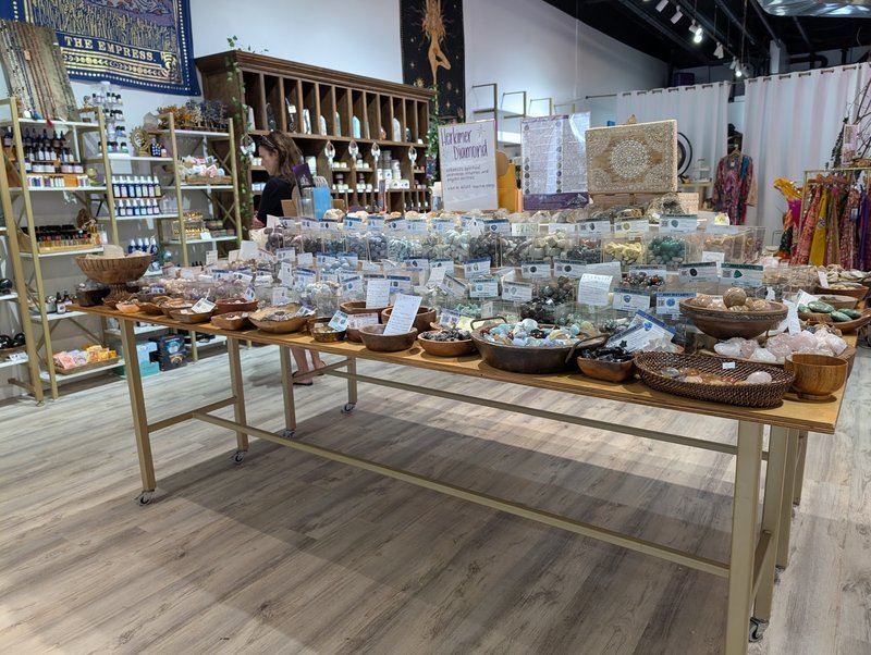 Collection of tumbled stones, raw minerals, and crystal clusters