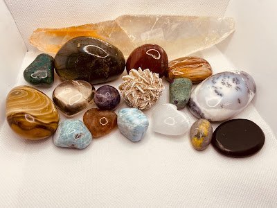 Selection of healing crystals, tumbled stones, and decorative mineral pieces