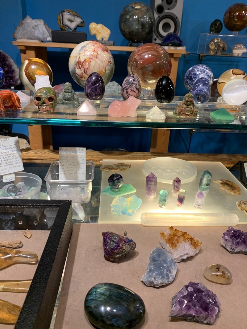 Crystal and mineral specimens including quartz, amethyst, and calcite varieties