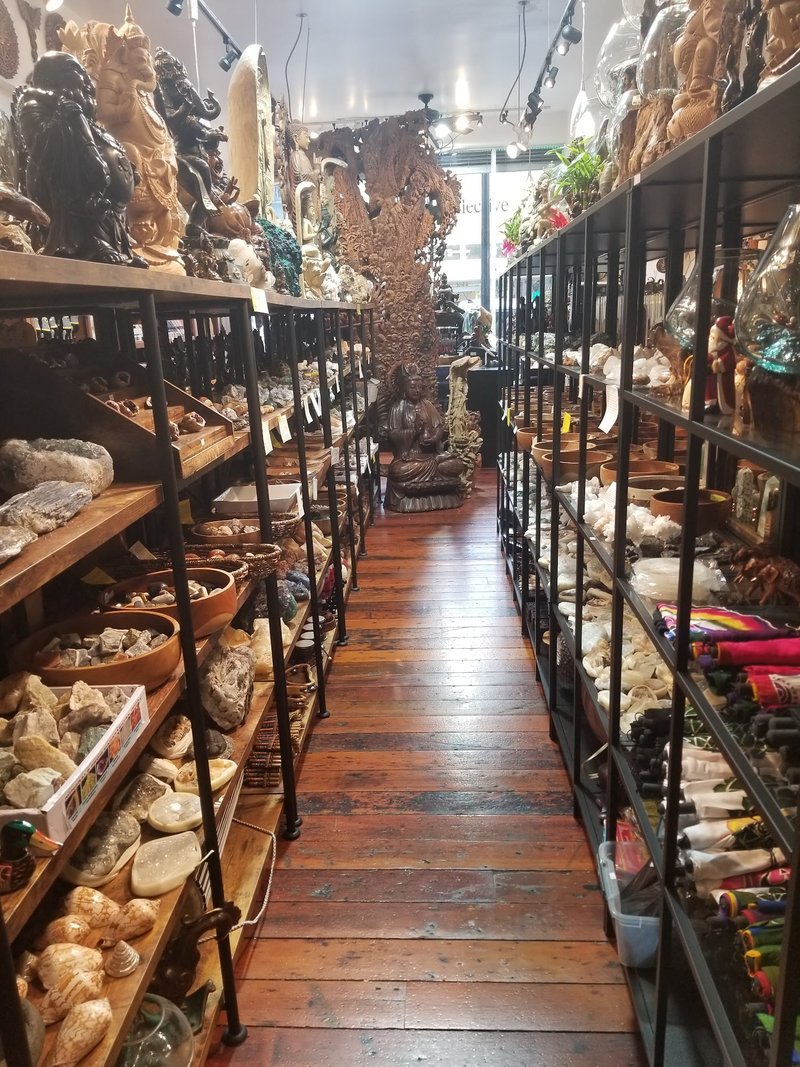 Shop interior featuring gemstones, healing crystals, and spiritual products