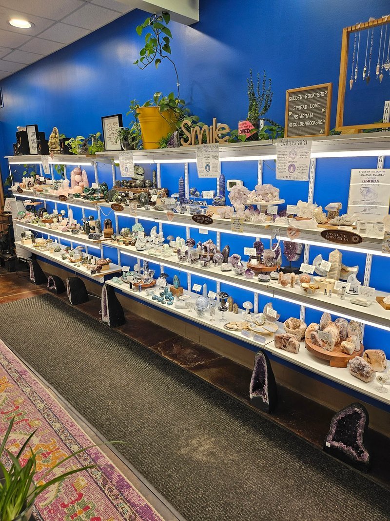 Collection of tumbled stones, raw minerals, and crystal clusters