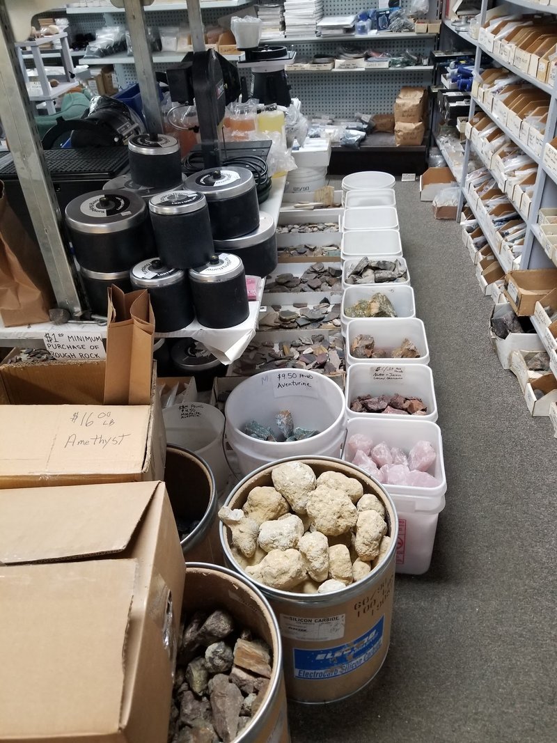 Retail shelving with organized crystals, stones, and spiritual products