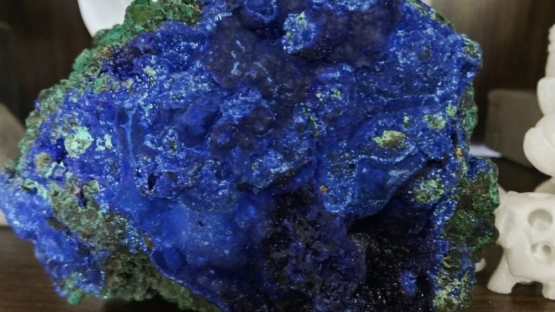 Retail display with tumbled stones, raw crystals, and polished specimens