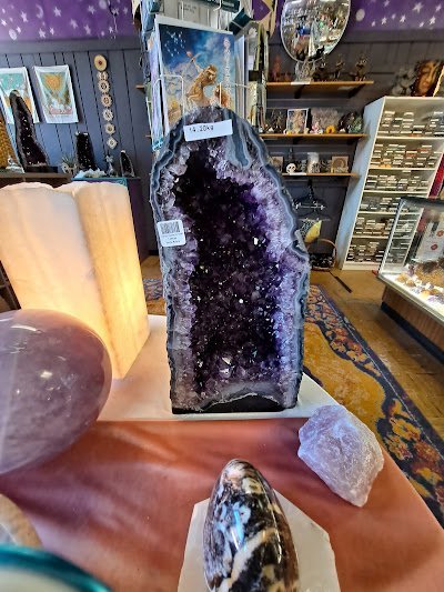 Organized crystal display with labeled stones and healing minerals