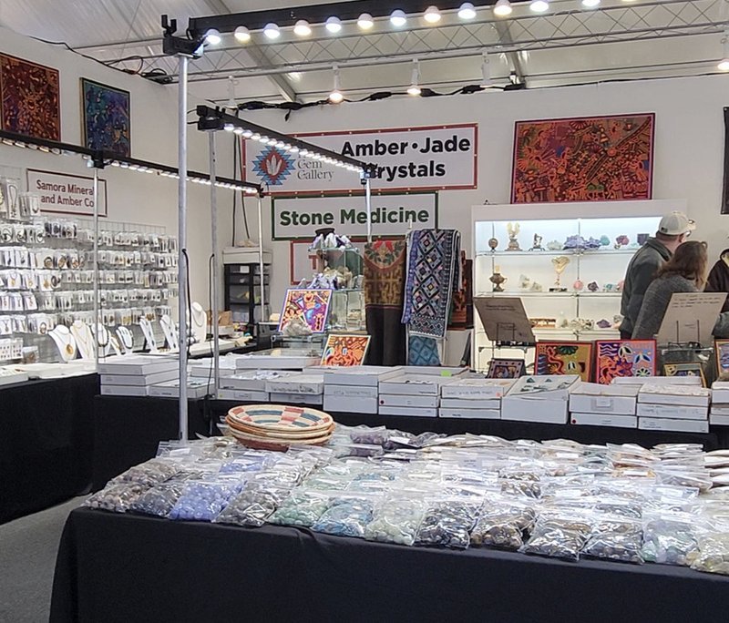 Retail shelving with organized crystals, stones, and spiritual products