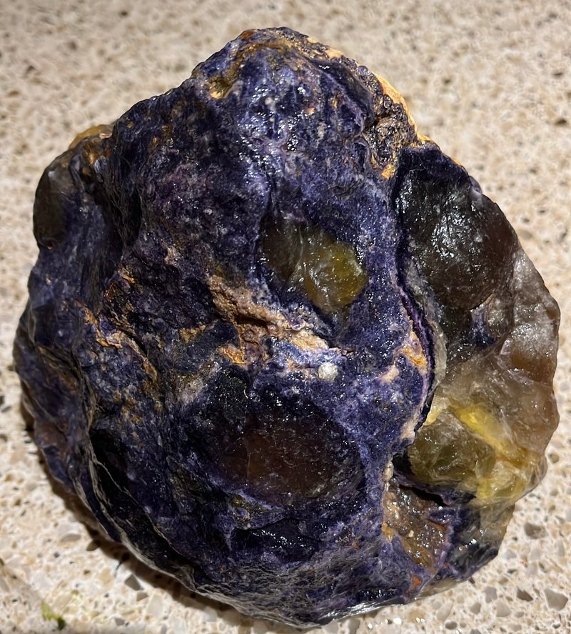 Variety of gemstones, crystal carvings, and polished mineral specimens