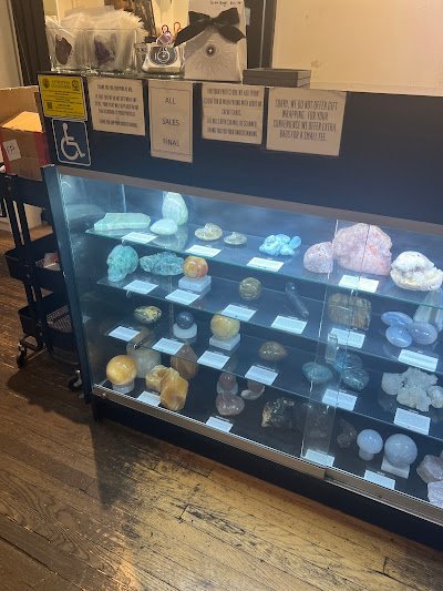 Selection of healing crystals, tumbled stones, and decorative mineral pieces