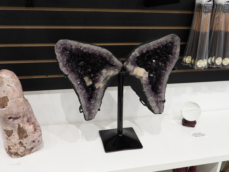 Collection of tumbled stones, raw minerals, and crystal clusters