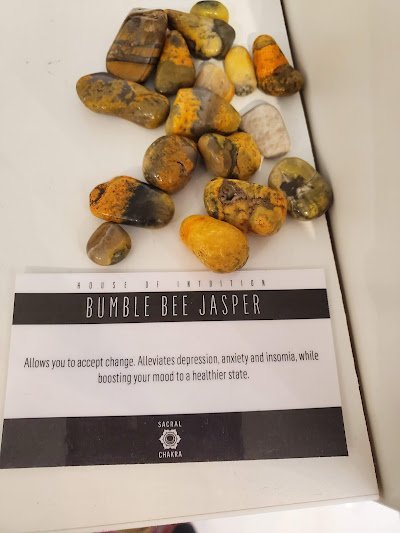 Selection of healing crystals, tumbled stones, and decorative mineral pieces