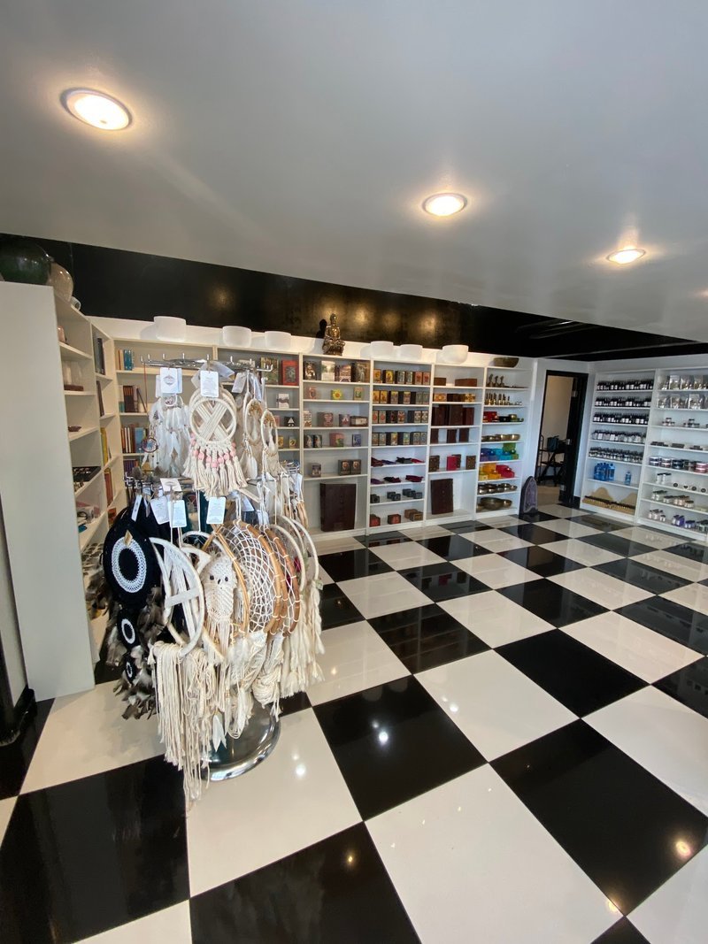 Collection of tumbled stones, raw minerals, and crystal clusters