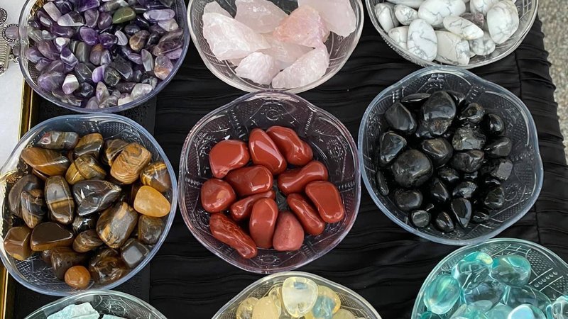 Retail display with tumbled stones, raw crystals, and polished specimens