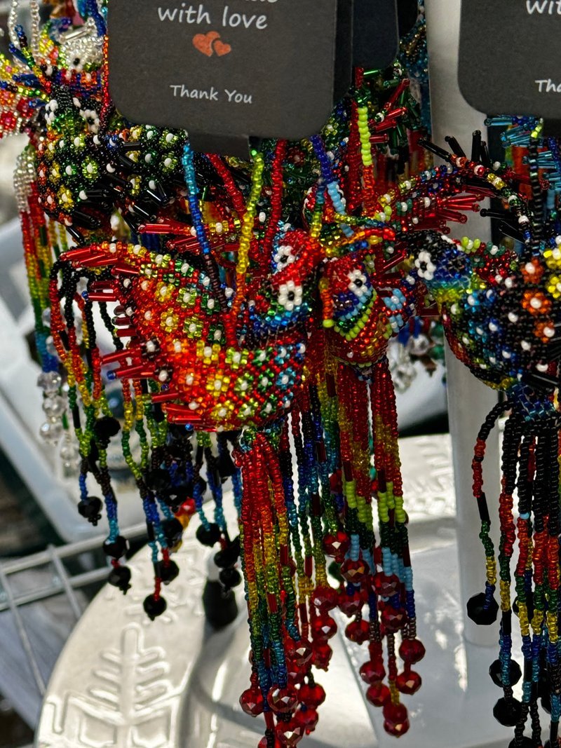 Variety of gemstones, crystal carvings, and polished mineral specimens