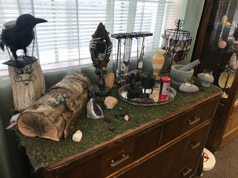 Variety of gemstones, crystal carvings, and polished mineral specimens