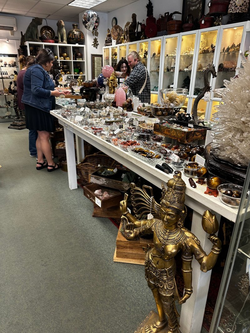 Shop interior featuring gemstones, healing crystals, and spiritual products