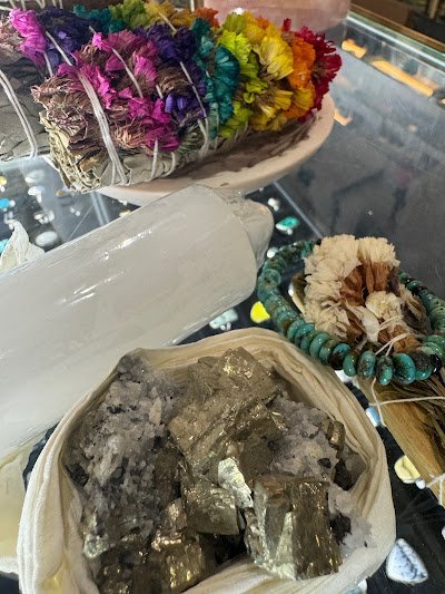 Retail shelving with organized crystals, stones, and spiritual products