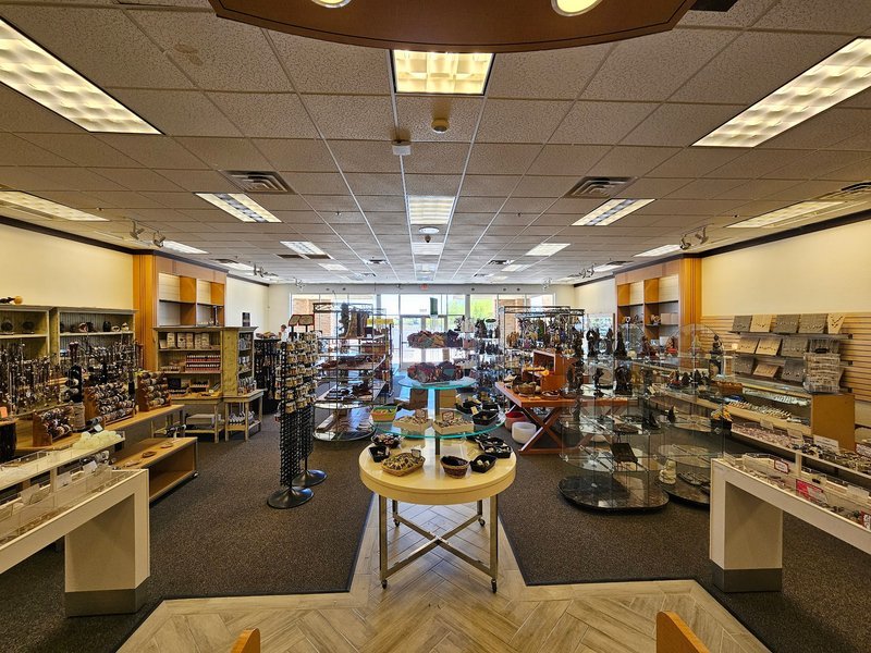 Collection of tumbled stones, raw minerals, and crystal clusters