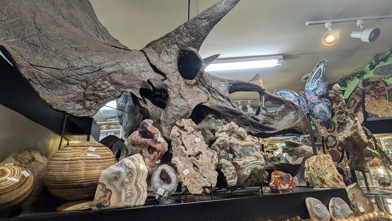 Display of polished crystal specimens, geodes, and mineral towers