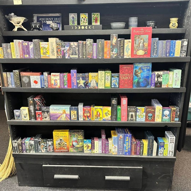 Retail shelving with organized crystals, stones, and spiritual products