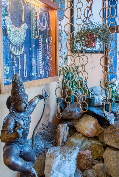 Organized crystal display with labeled stones and healing minerals