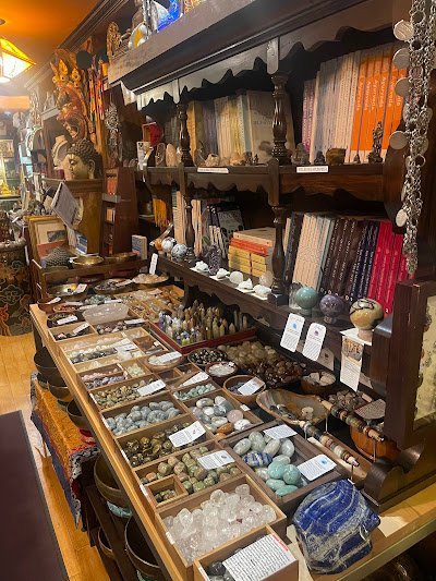 Shop interior featuring gemstones, healing crystals, and spiritual products
