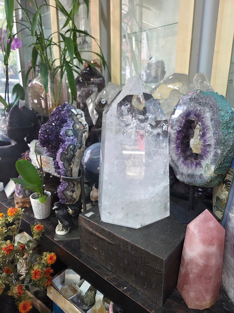 Display of polished crystal specimens, geodes, and mineral towers