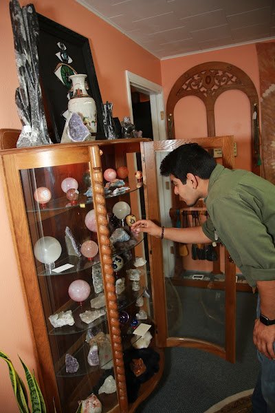 Retail display with tumbled stones, raw crystals, and polished specimens
