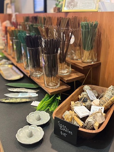 Collection of tumbled stones, raw minerals, and crystal clusters
