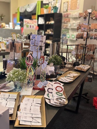 Retail shelving with organized crystals, stones, and spiritual products