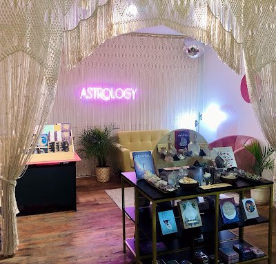 Display featuring crystal points, polished stones, and raw mineral specimens