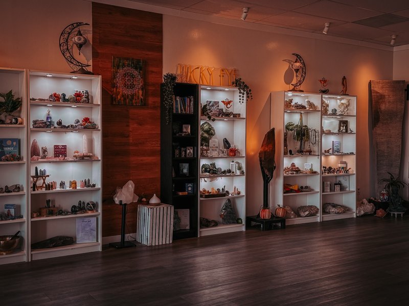 Organized crystal display with labeled stones and healing minerals