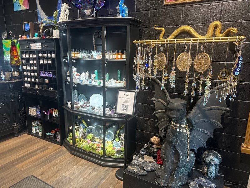 Shop interior featuring gemstones, healing crystals, and spiritual products
