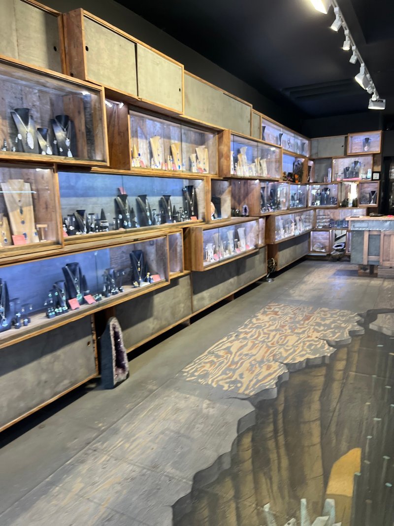 Organized crystal display with labeled stones and healing minerals