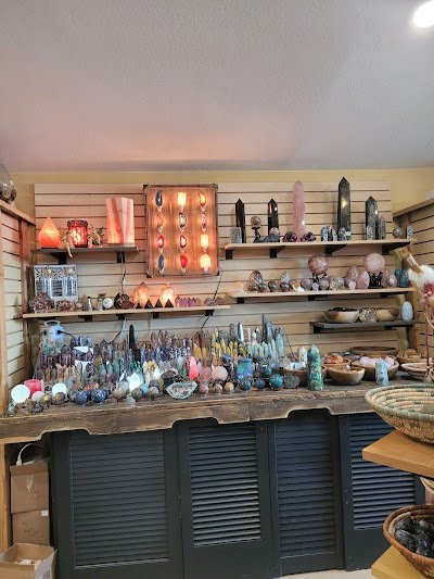 Organized crystal display with labeled stones and healing minerals