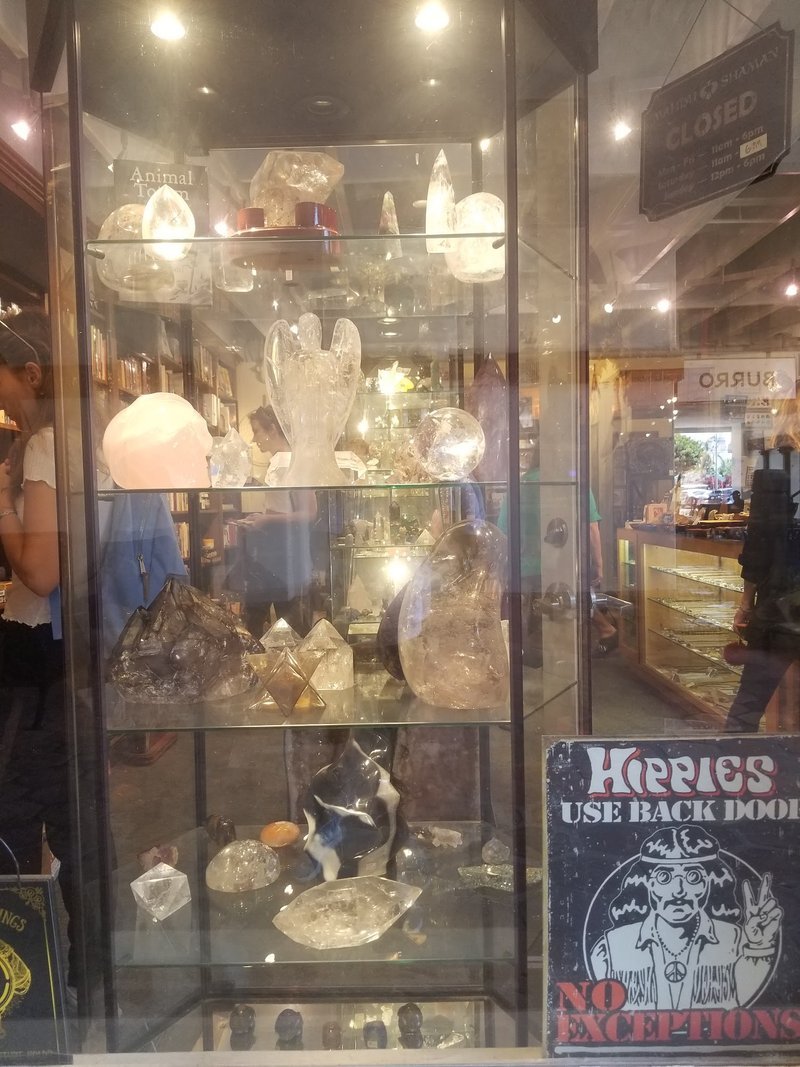 Display of polished crystal specimens, geodes, and mineral towers