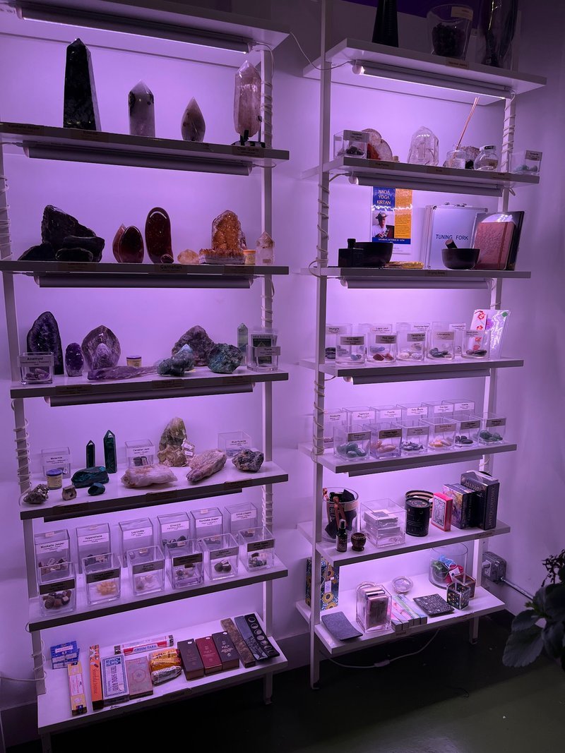 Display featuring crystal points, polished stones, and raw mineral specimens