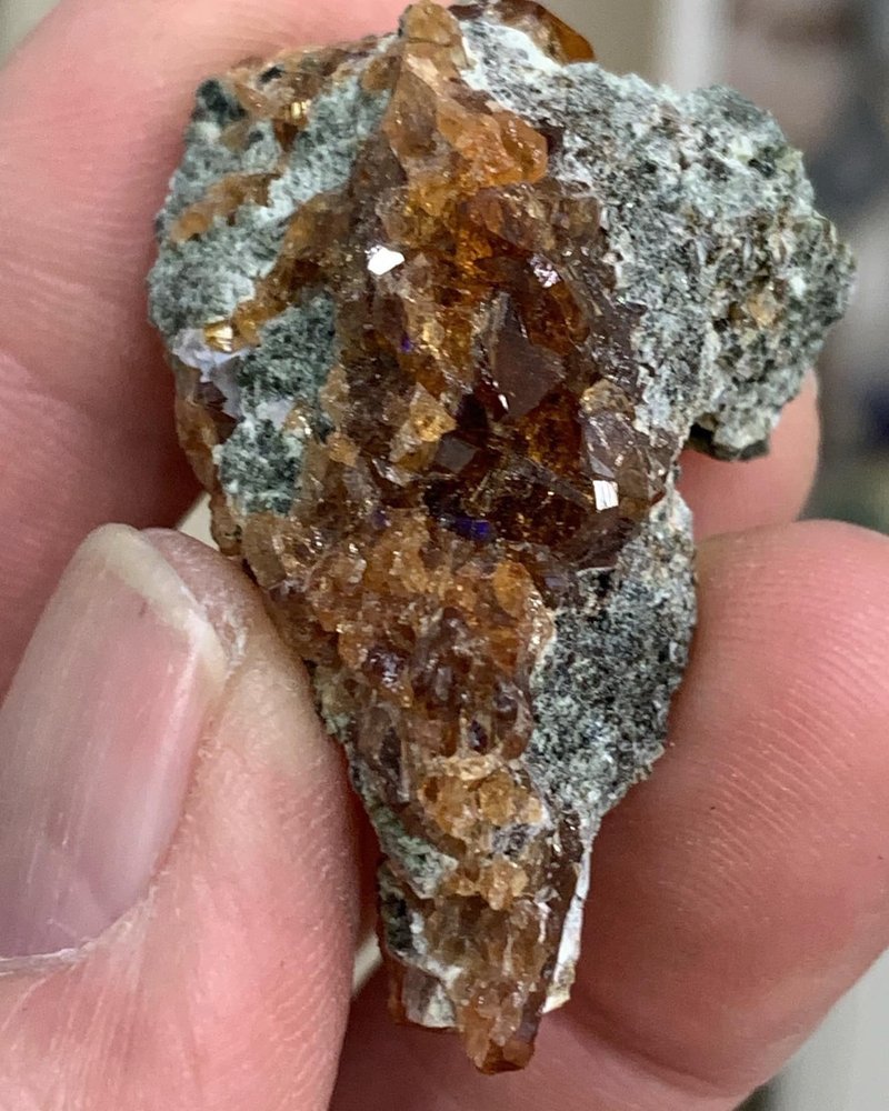 Variety of gemstones, crystal carvings, and polished mineral specimens