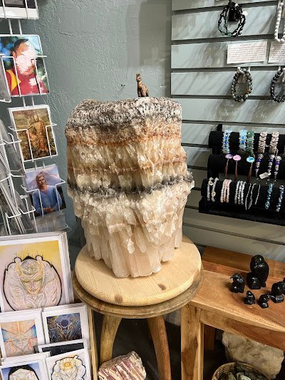 Shop interior featuring gemstones, healing crystals, and spiritual products