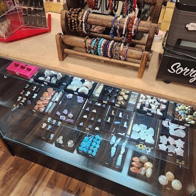 Collection of tumbled stones, raw minerals, and crystal clusters