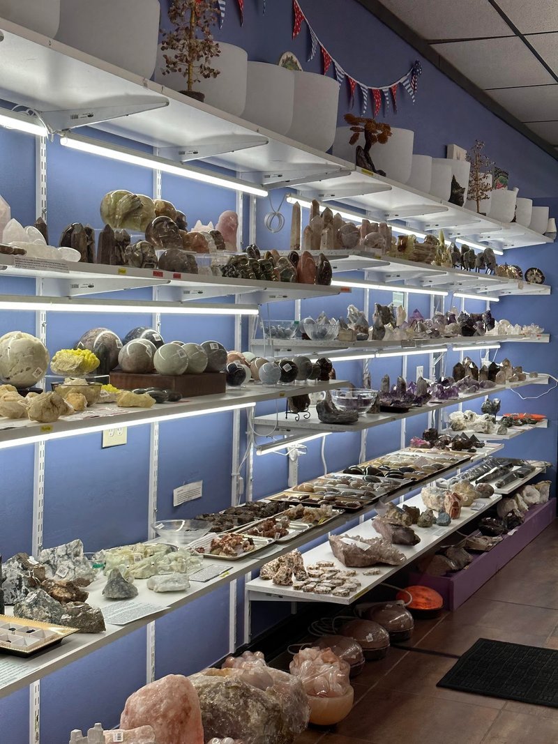 Organized crystal display with labeled stones and healing minerals