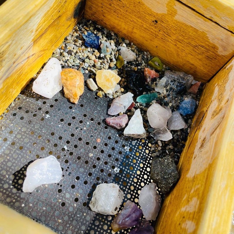 Interior view showcasing crystal towers, spheres, and carved stone pieces
