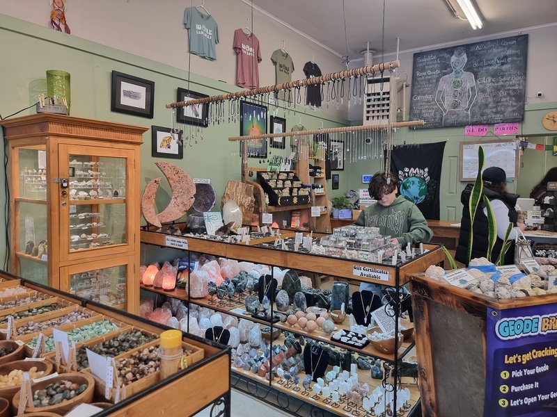 Selection of healing crystals, tumbled stones, and decorative mineral pieces