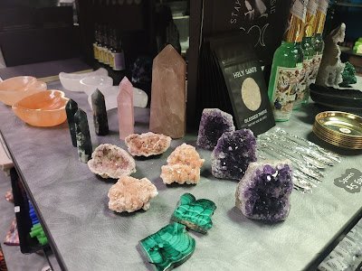 Retail display with tumbled stones, raw crystals, and polished specimens