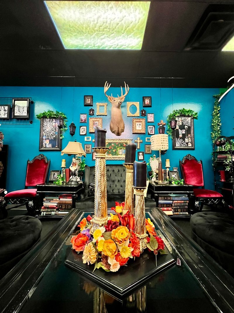 Variety of gemstones, crystal carvings, and polished mineral specimens