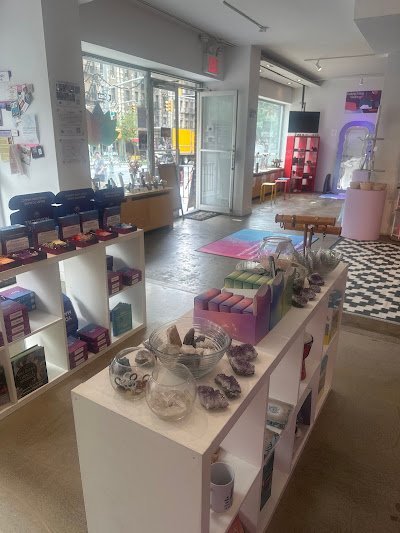 Retail shelving with organized crystals, stones, and spiritual products