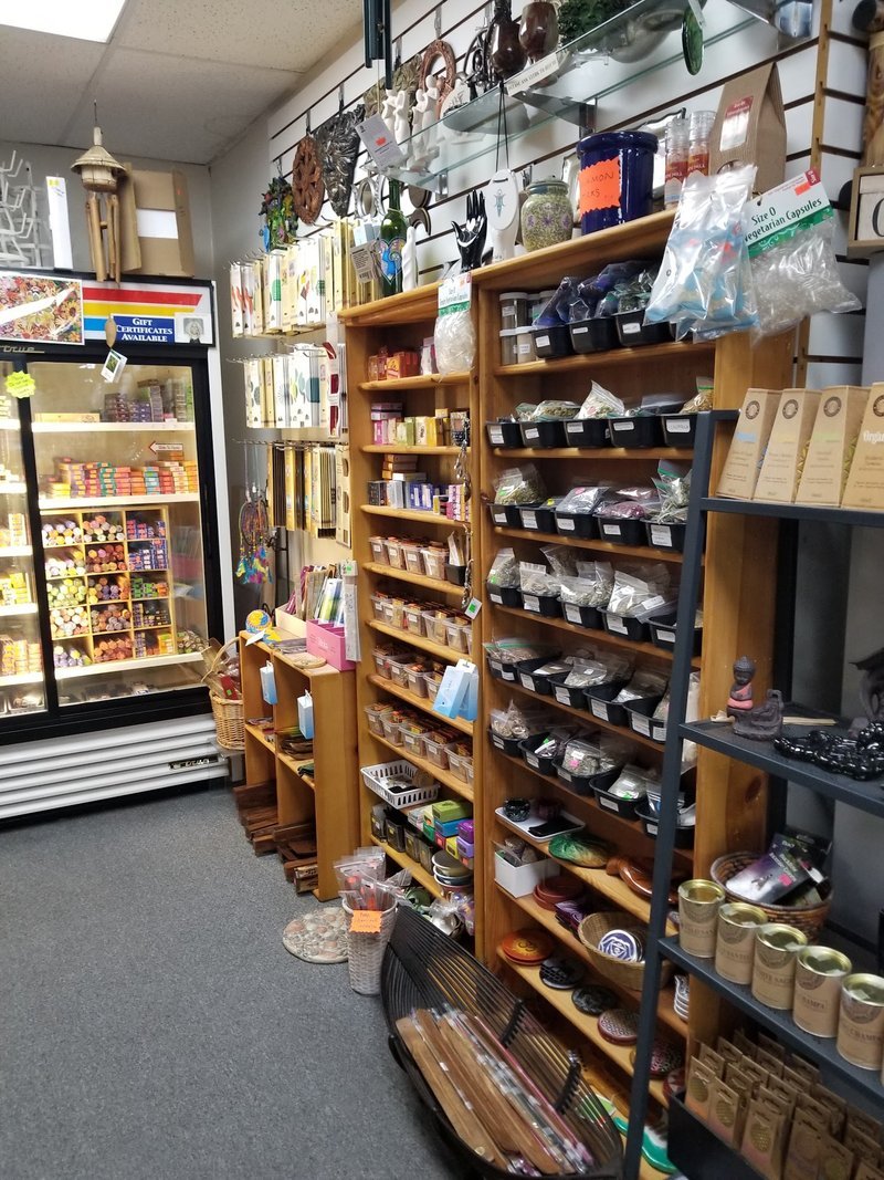 Shop interior featuring gemstones, healing crystals, and spiritual products