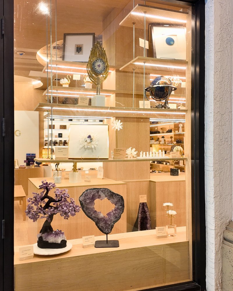 Shop interior featuring gemstones, healing crystals, and spiritual products