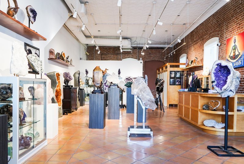 Shop interior featuring gemstones, healing crystals, and spiritual products
