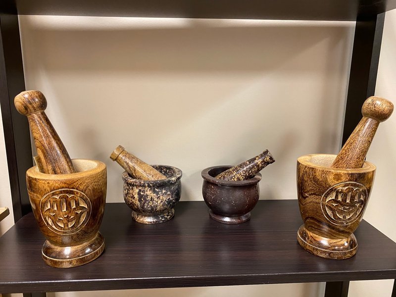 Display featuring crystal points, polished stones, and raw mineral specimens