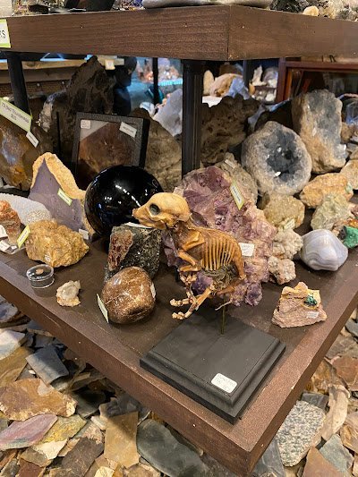 Selection of healing crystals, tumbled stones, and decorative mineral pieces